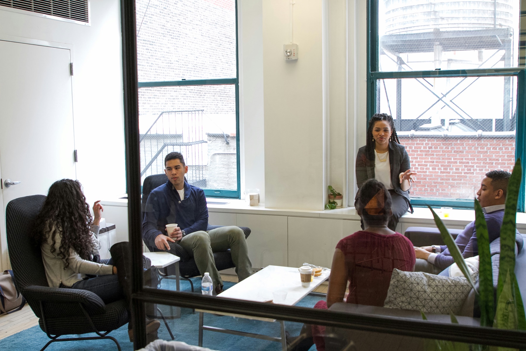 Colleagues gathered in conversation during a team offsite